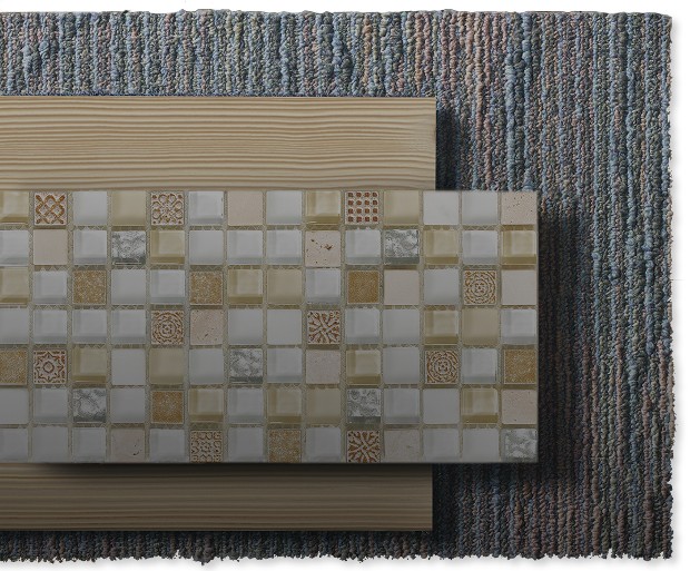 A mosaic tile on top of a plank of blonde wood and a grey rug.