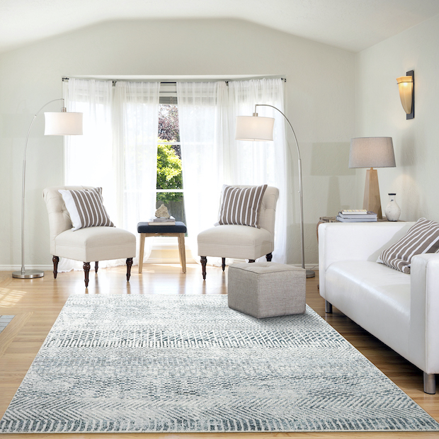 room with gray and ivory rug