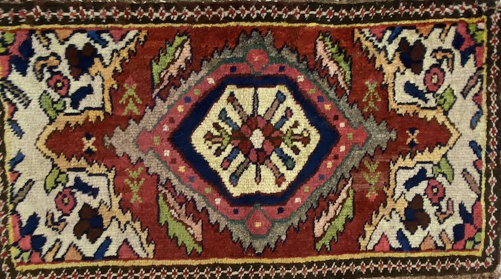 an antique gabbed area rug