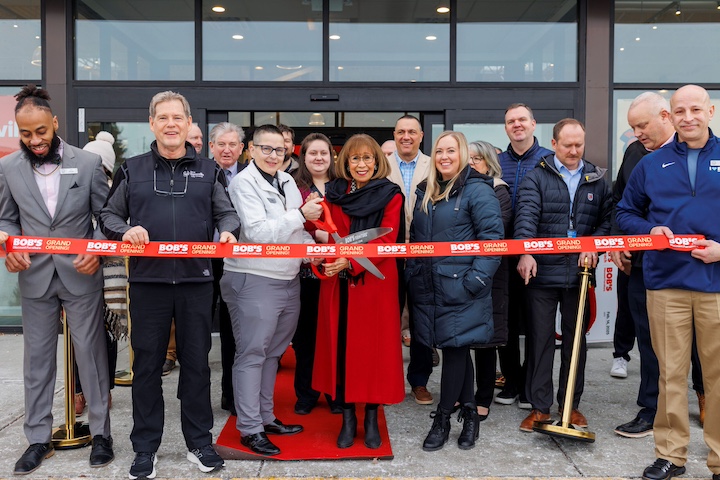 The Bob's Discount Furniture team cuts the ribbon on a new Burnsville, Minnesota store