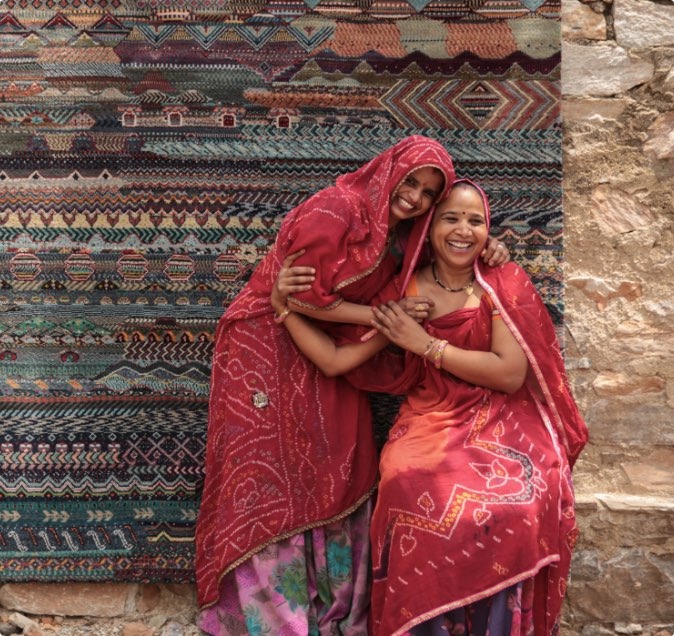 Jaipur weavers posing infant of area rug