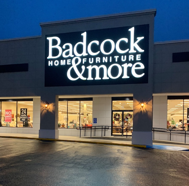 Badcock Home Furniture store exterior at night